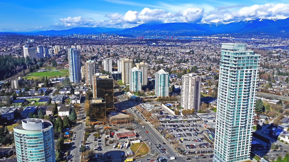 The,Aerial,View,On,Skycrapers,,Buildings,And,Mountains,In,Burnaby,